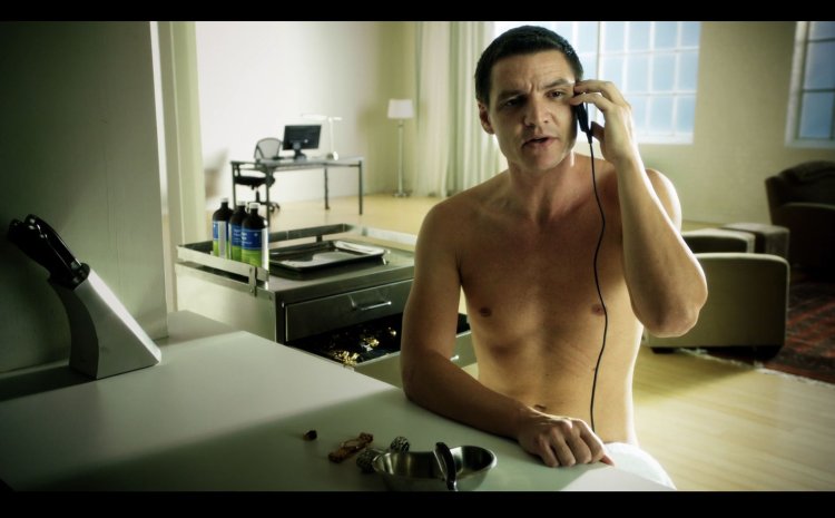 Pedro Pascal in a rocking chair