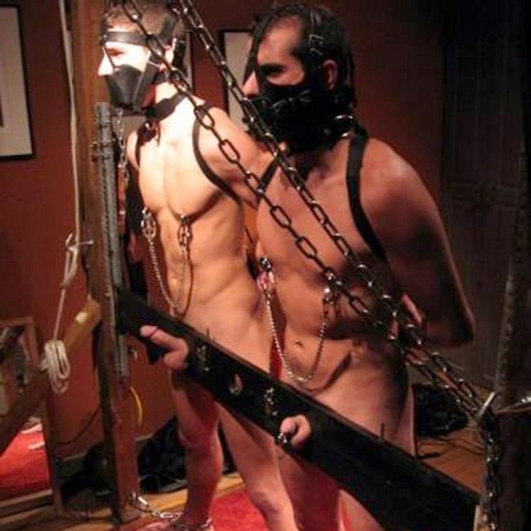 Two men in bdsm costumes