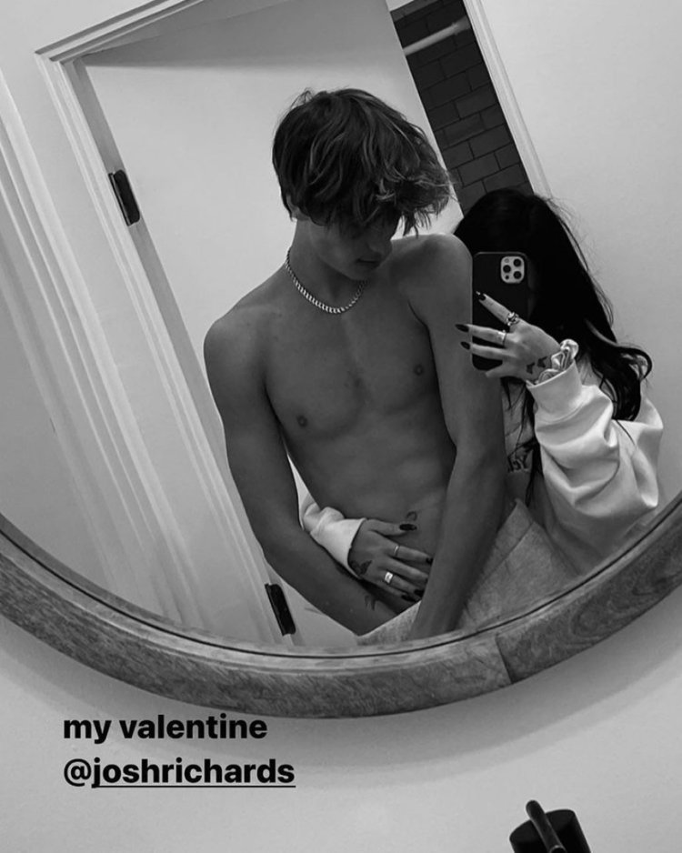 Nessa and Jaden behind the curtain