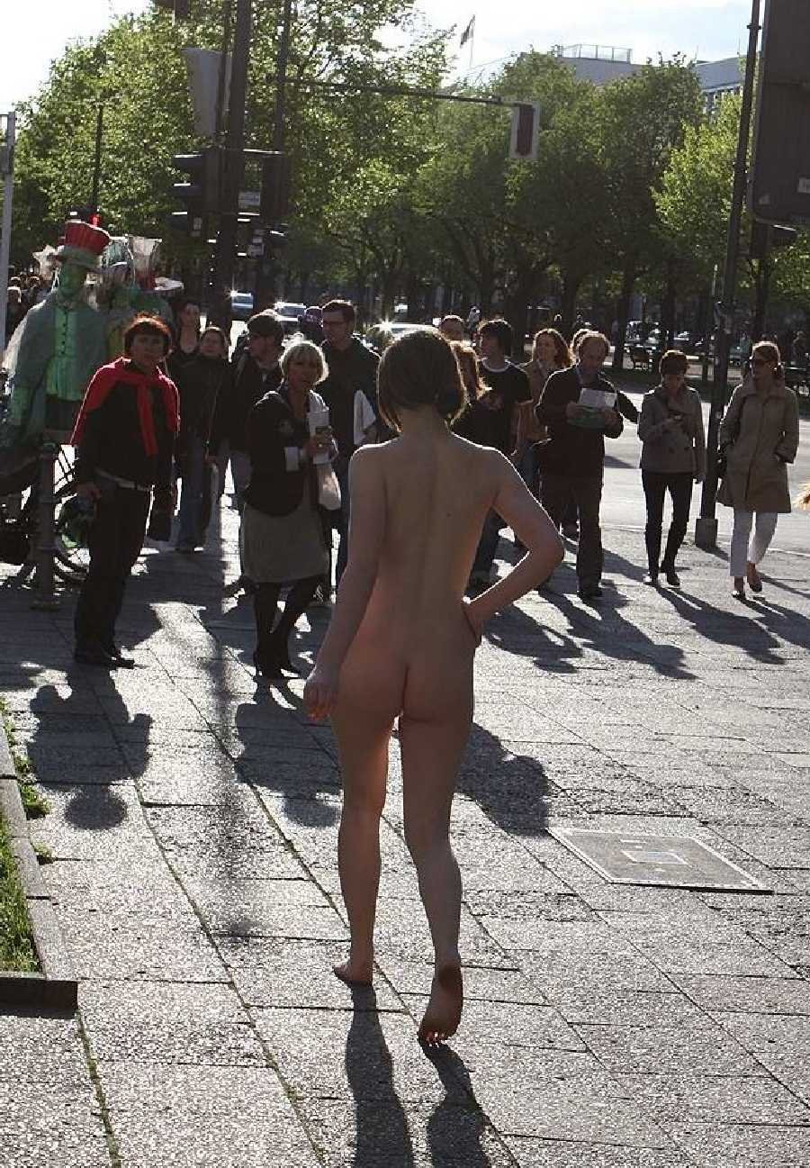 Girl Walks Naked in Public Place with Dressed Men