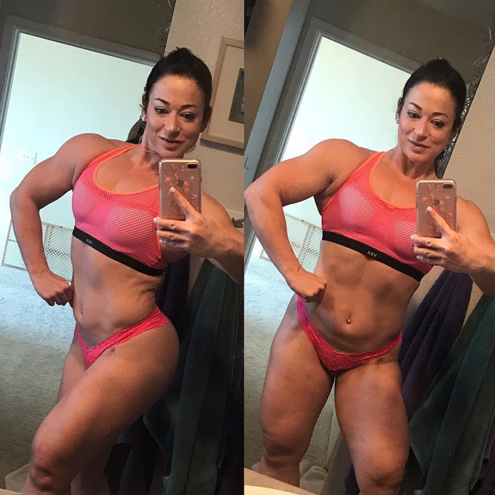 Bodybuilder girl poses in full height