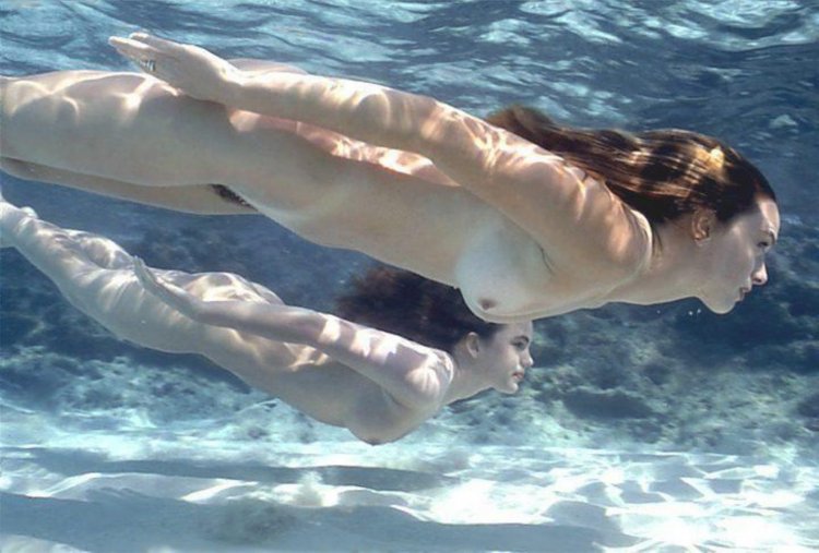 Nude woman diving