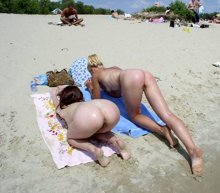 Naked female ass on the beach
