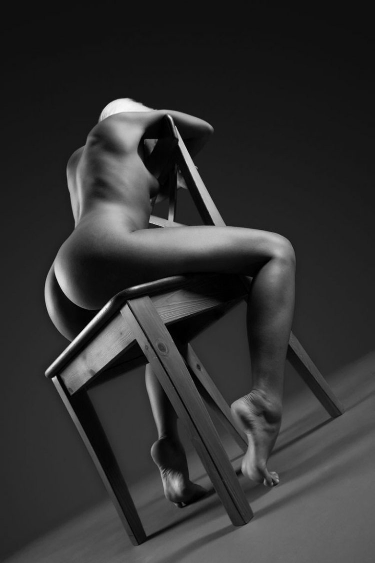 Nude photo session on a chair