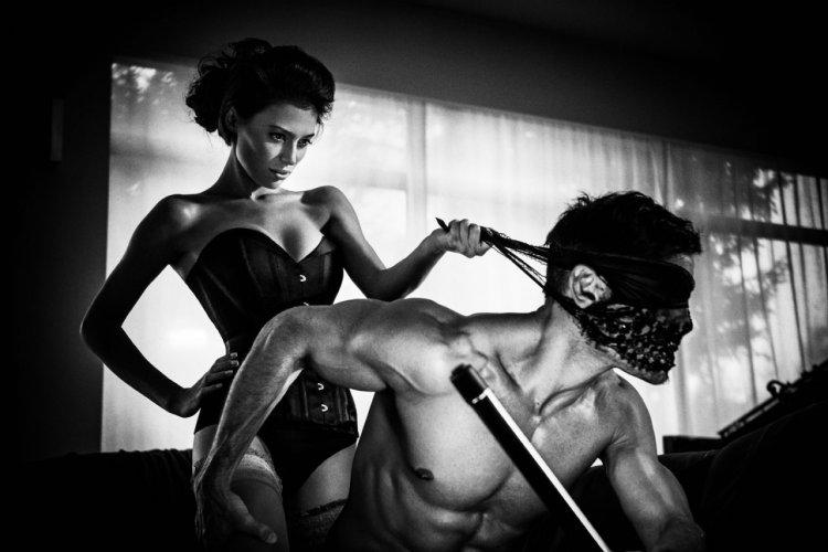 Has knees in front of her husband