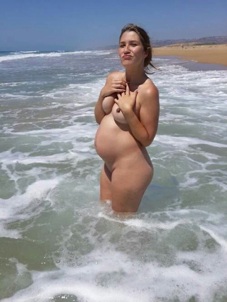 Pregnant nudist on the beach