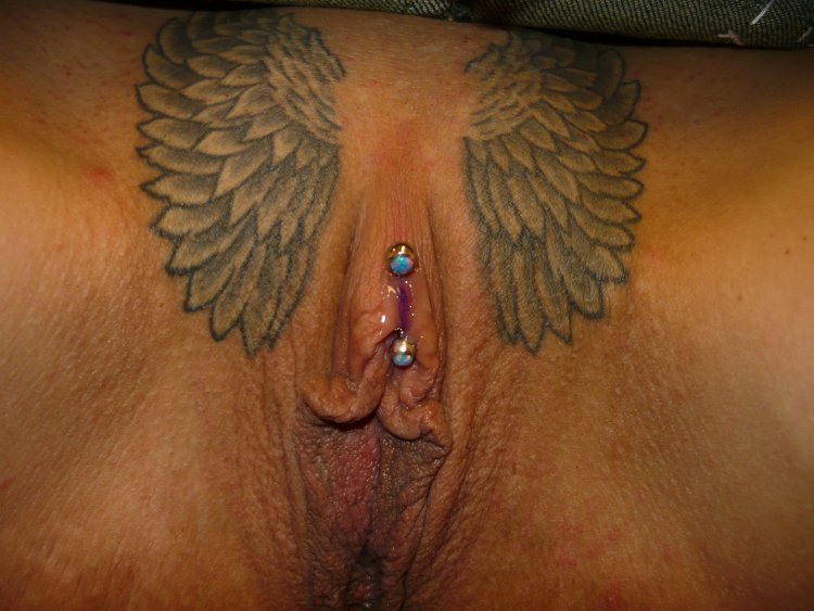 Intimate women's tattoo naked