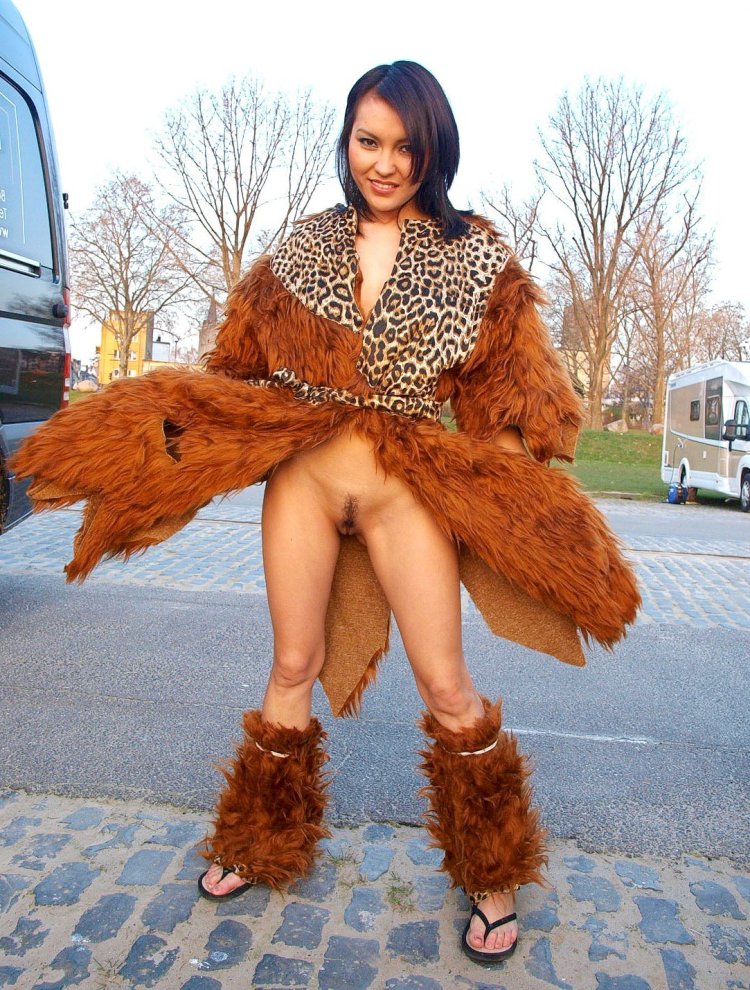 Girls in a coat and without panties with a belt