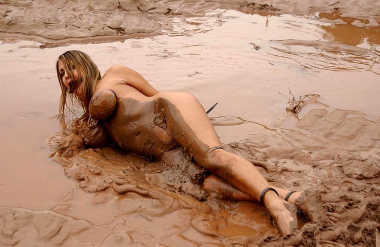 Girl in mud without clothes