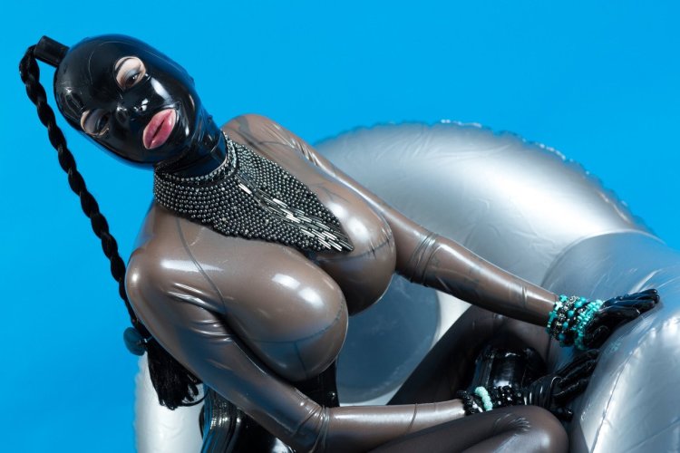 Girl in latex with huge boobs