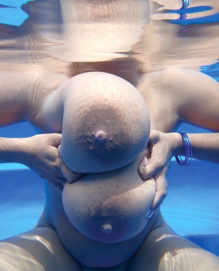 Naked and beautiful in the pool