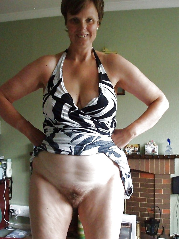 Mature in a t-shirt without panties