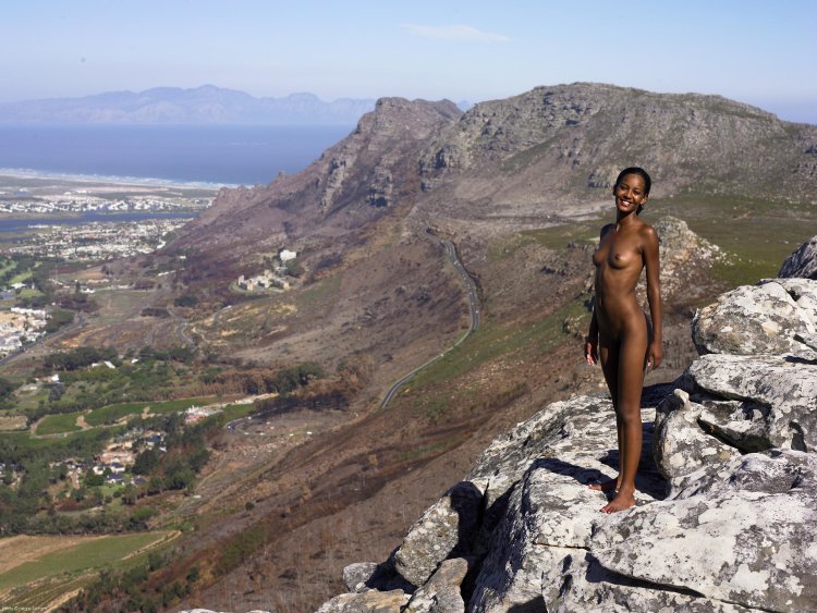Naked woman on the top of the mountain