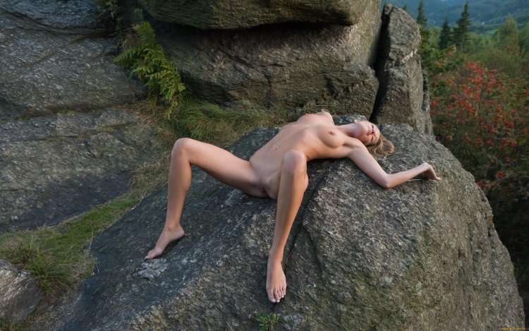 Photo session naked on a rock