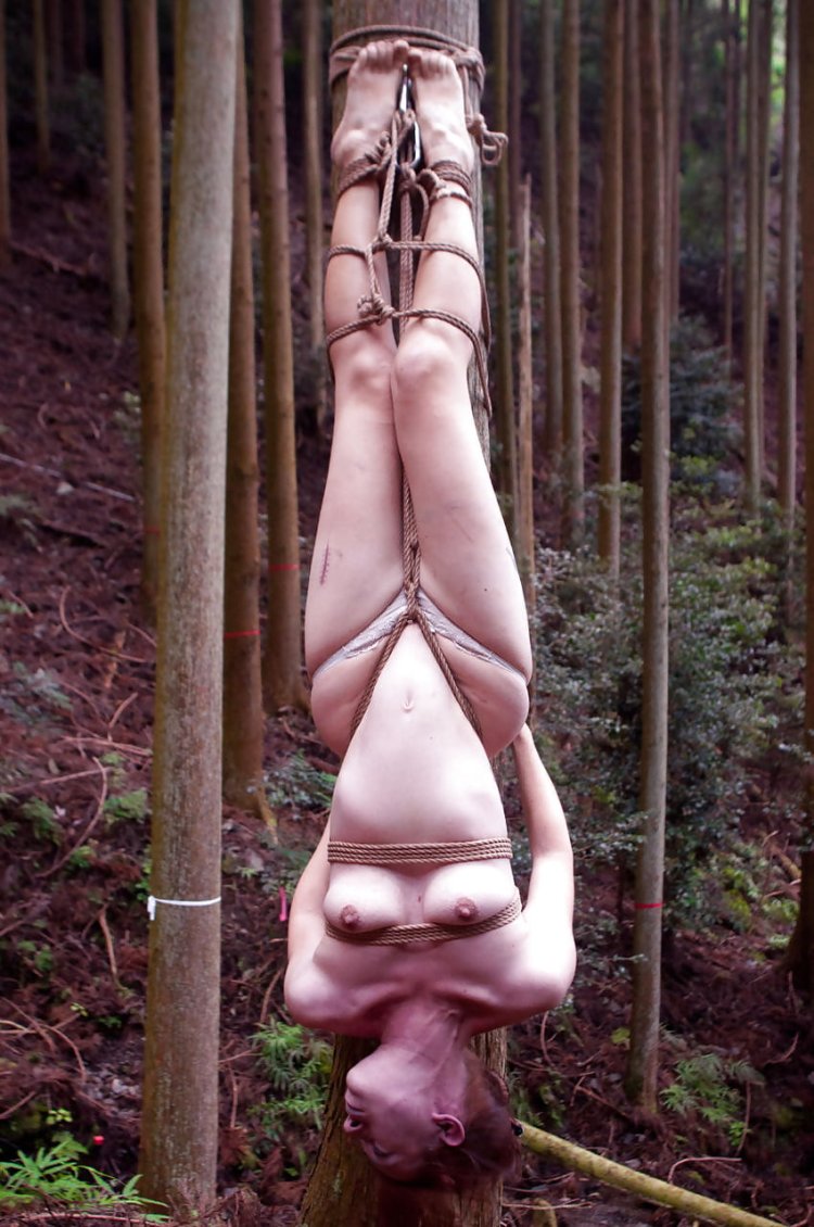 Naked woman upside down
