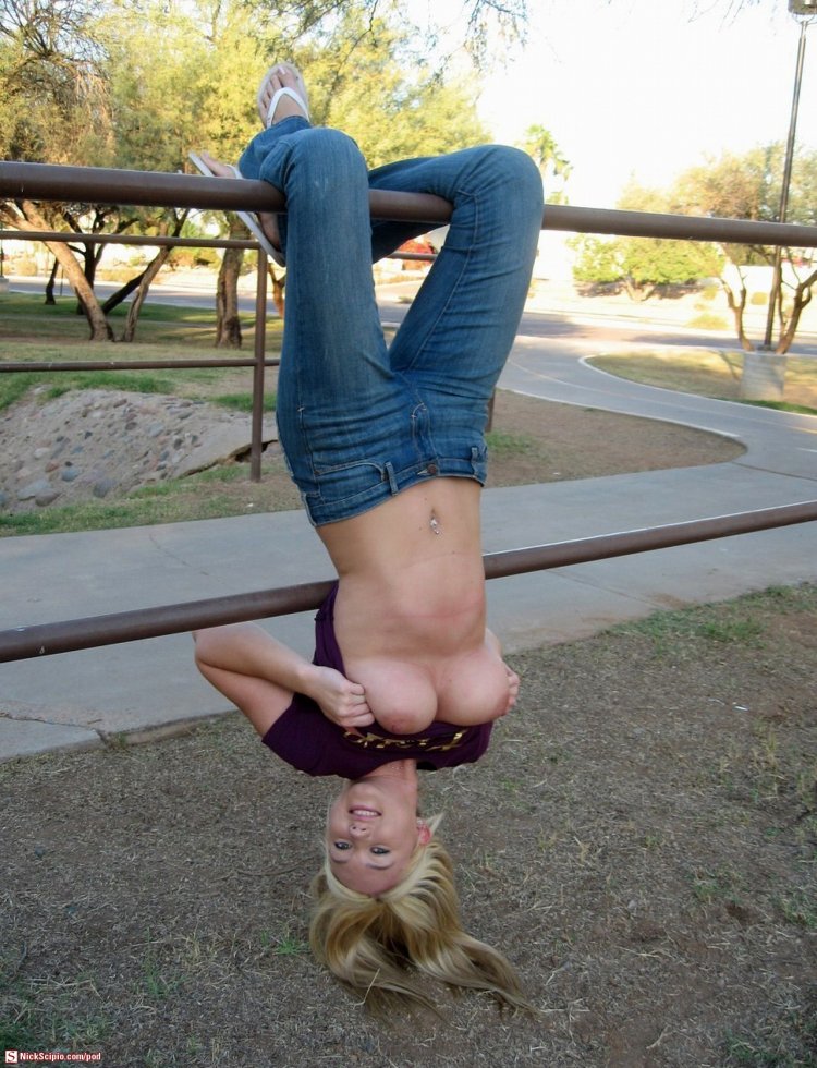 Naked hanging upside down