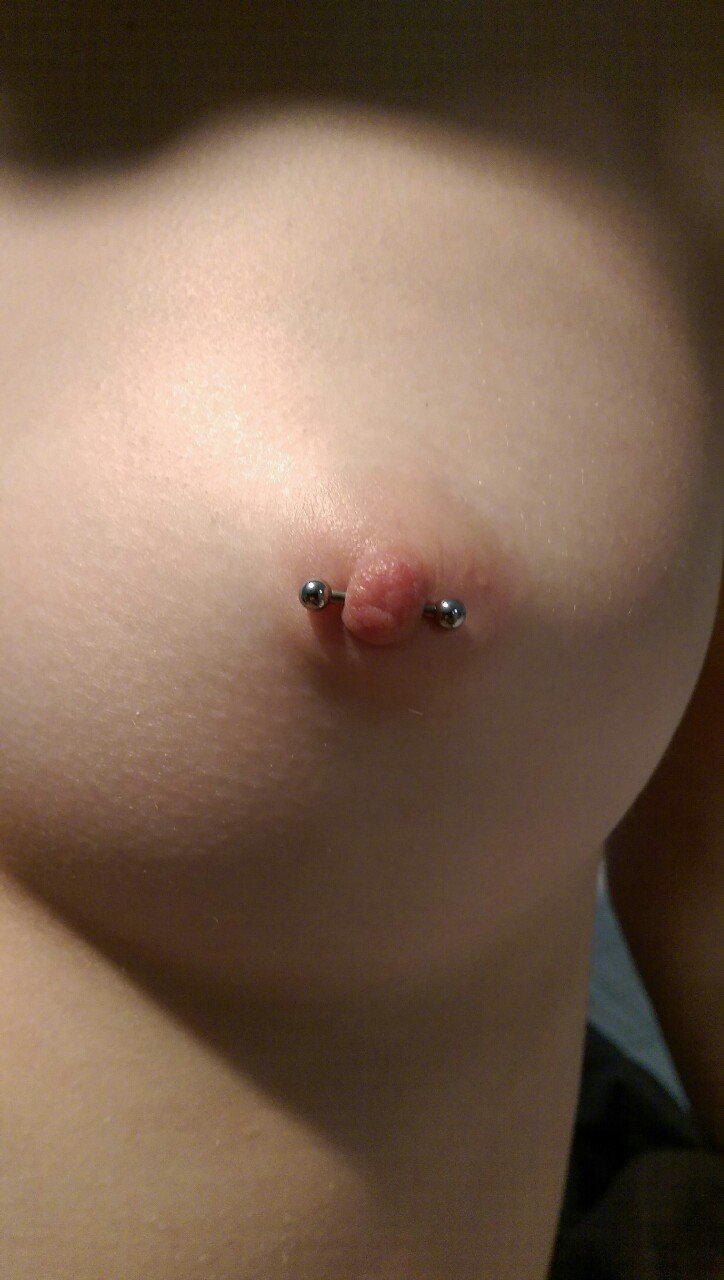Teen girl with nipple piercing