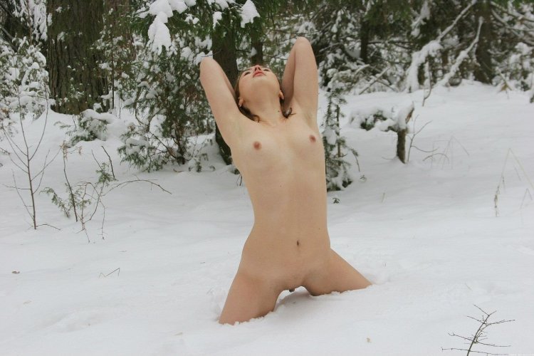 Naked women lie on the snow