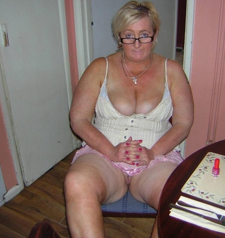 Old woman in a skirt without panties