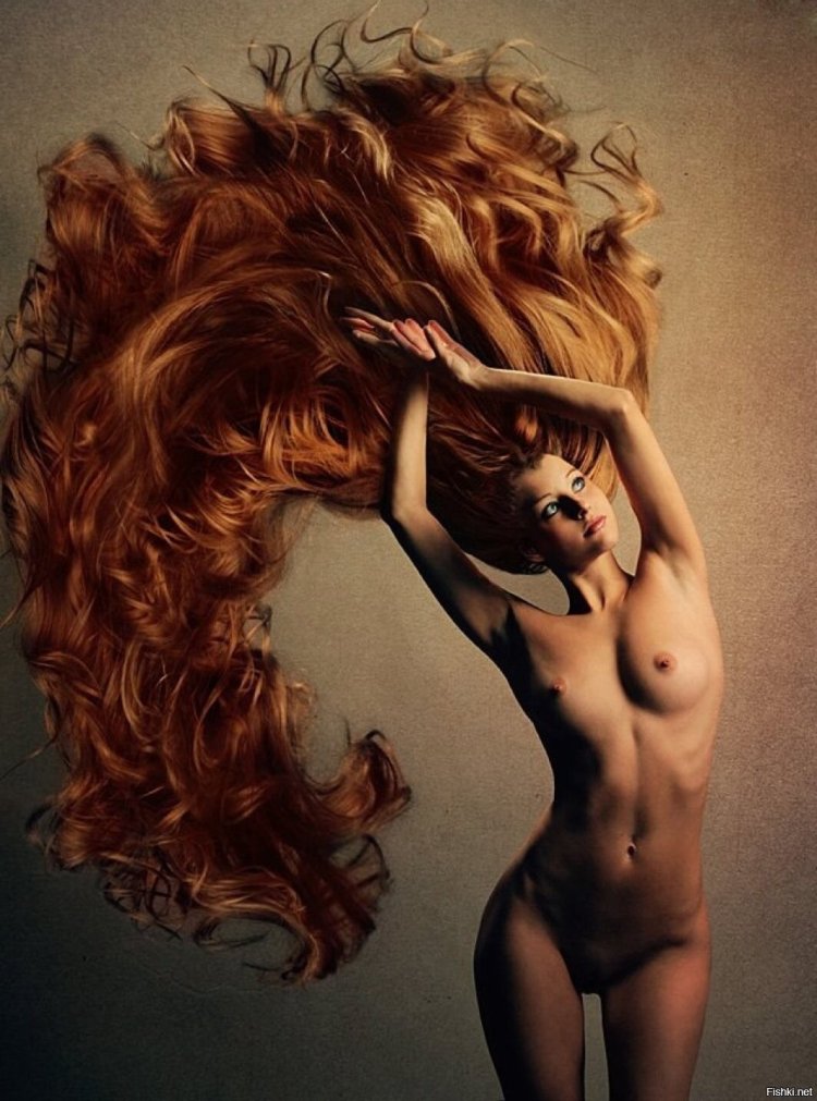 Red -haired girl with long hair nude
