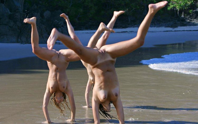Girls jump into the water nude