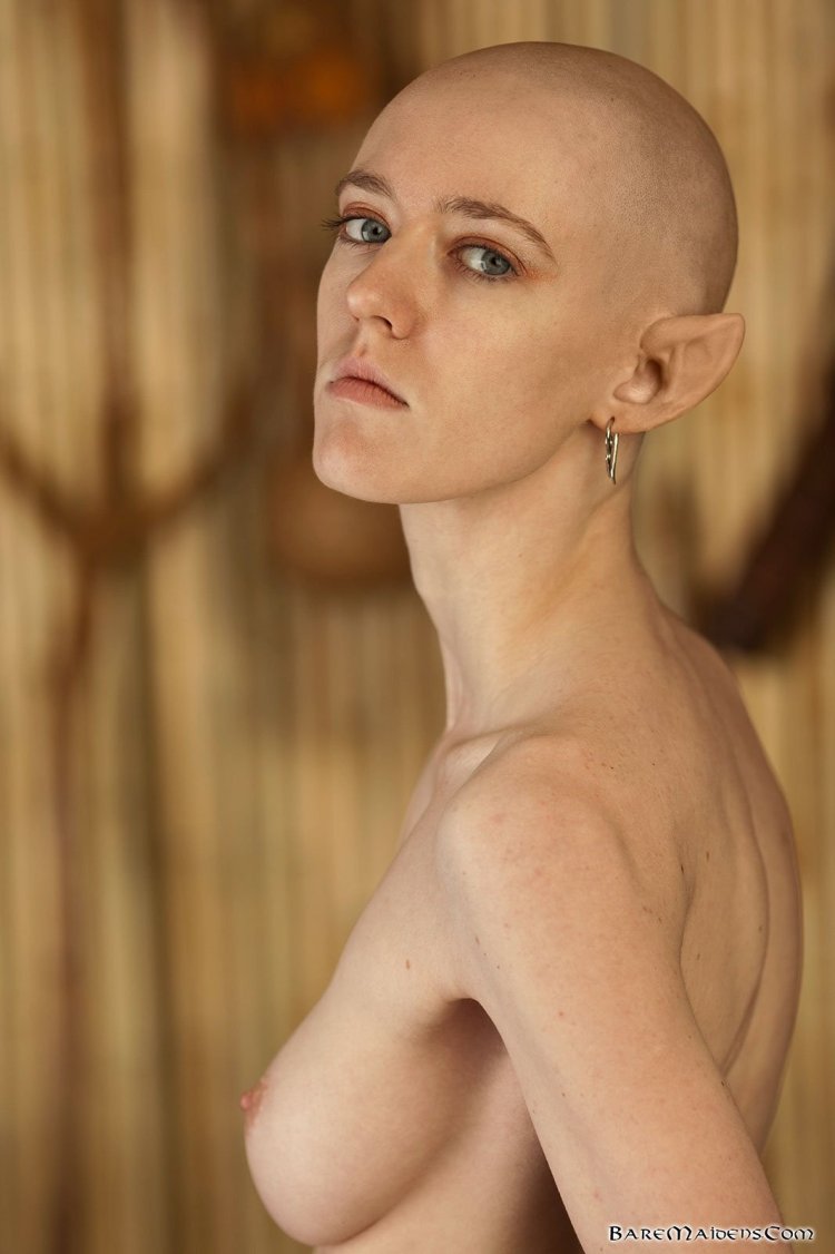 Naked woman with a bald head