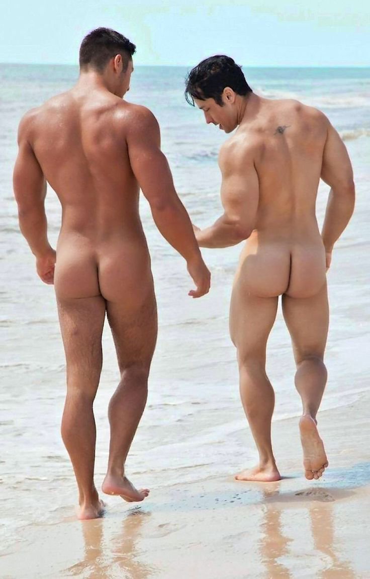 Naked guys sunbathe on the beach