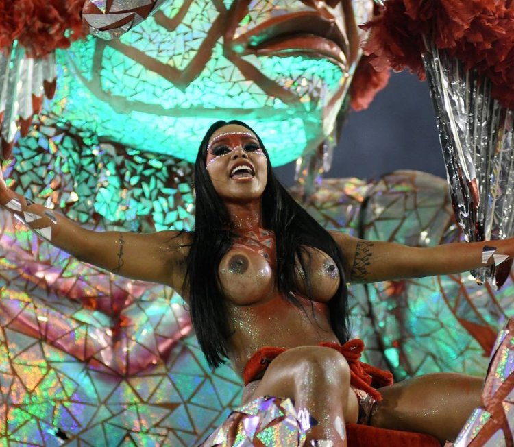 Naked women in carnival costumes