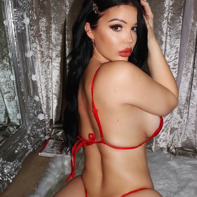 Naked in nature in a stream