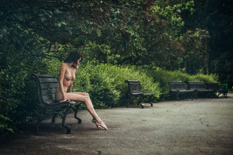 Naked girls on a bench