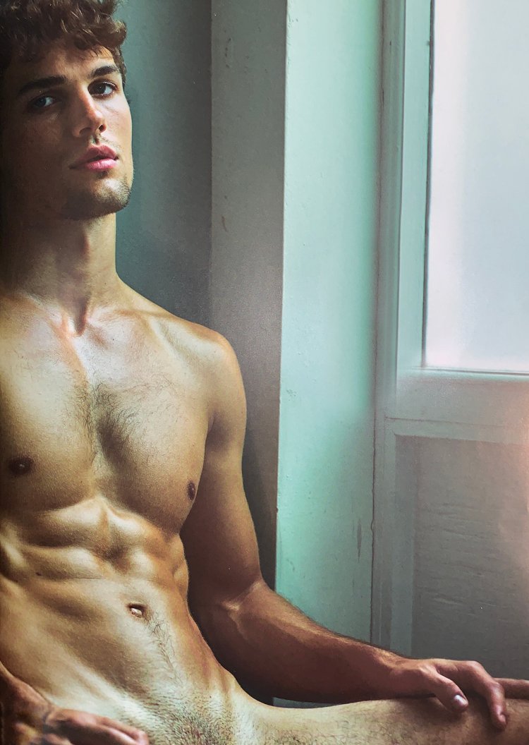 Boy in swimming trunks on the beach