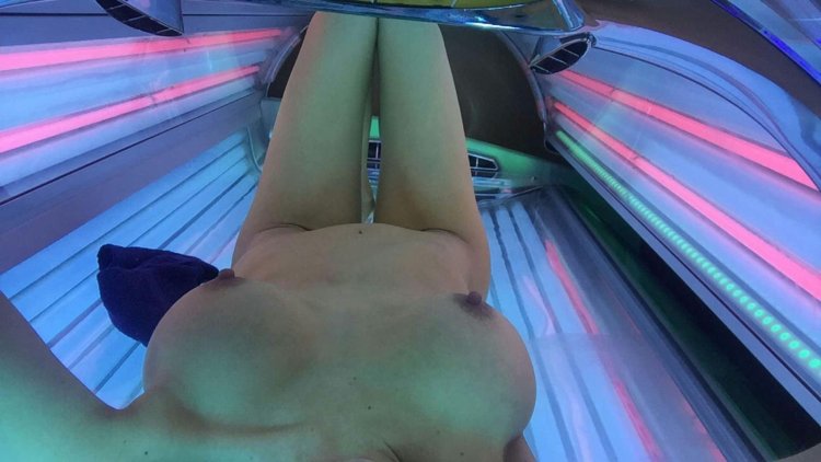 Girls undress in solarium