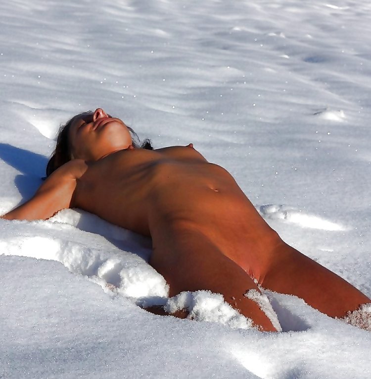 A beautiful woman lies naked in the snow of the priest