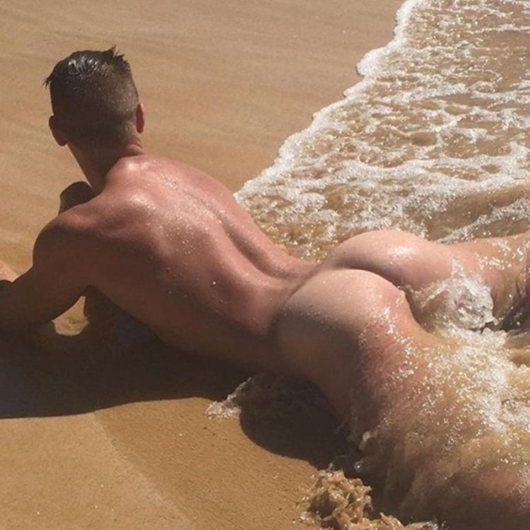 Beautiful men's butt on the beach