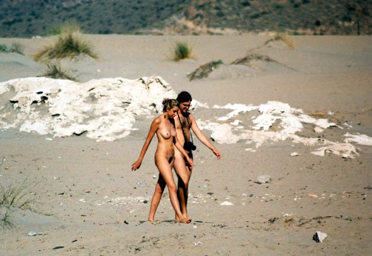 Naked men's buttocks on the beach