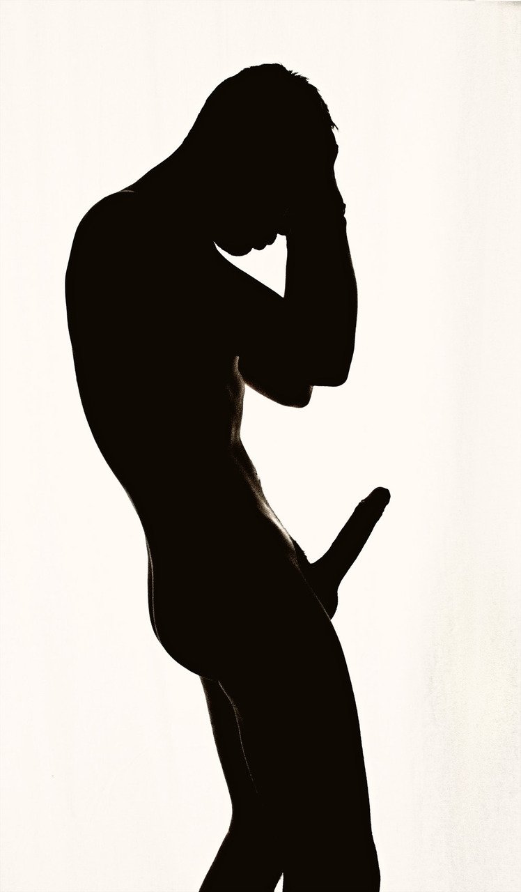 The silhouette of a naked person