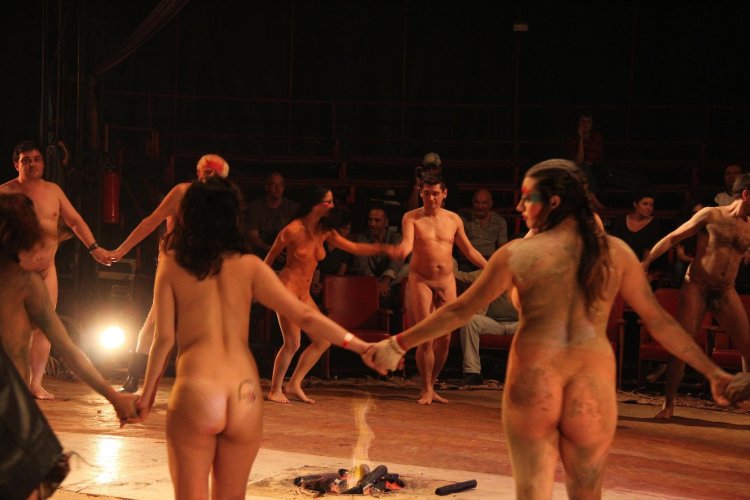 Naked performers on stage