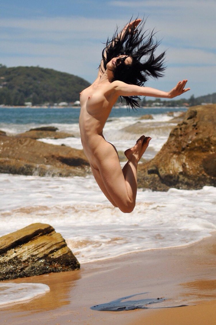 Naked women jump into the water