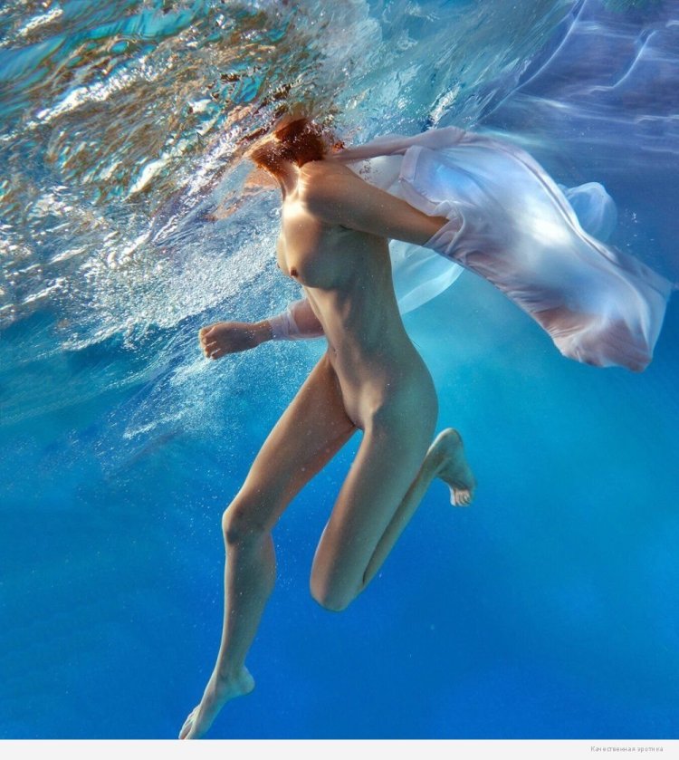 Naked pregnant woman under water