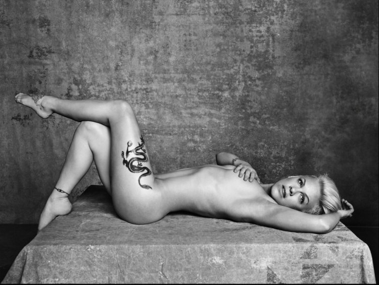 Naked on stage with a microphone