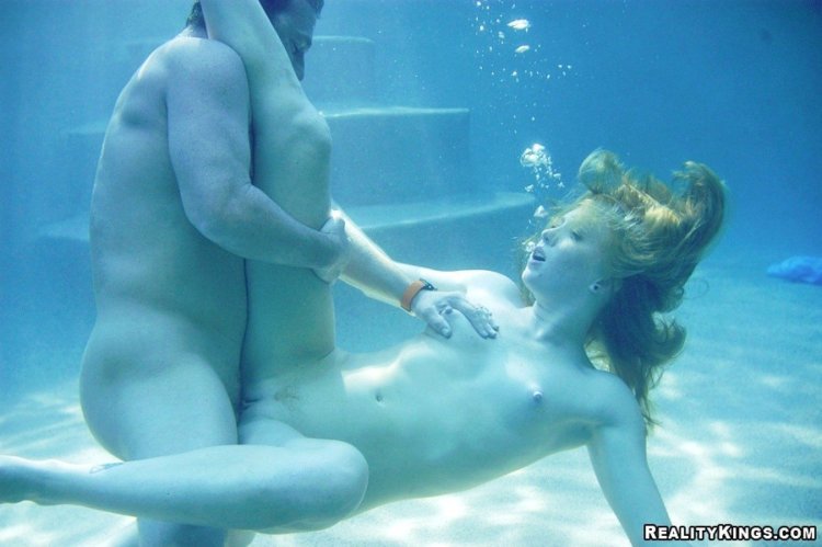 Naked man and woman in water