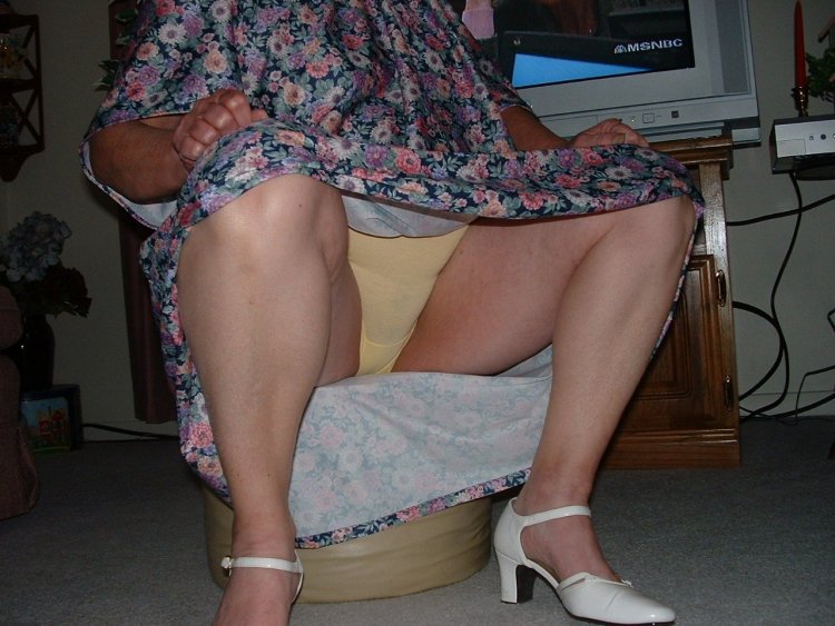 Mature in panties under the skirt