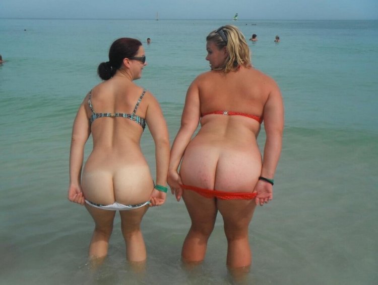 Nude Overweight Woman on the Beach Stock Photo