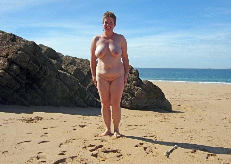 Full women on a nudist beach