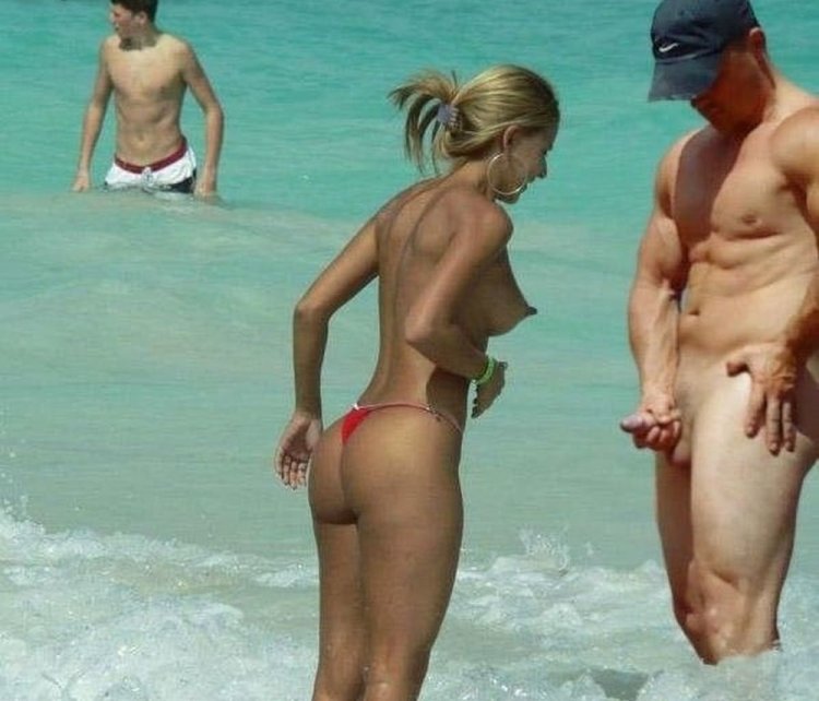 Naked men and women on the beach