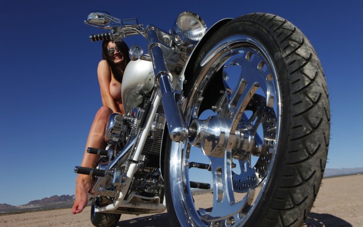 Naked girl on a motorcycle