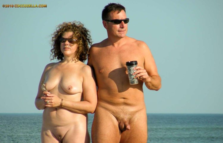 Naked mature married couples on the beach