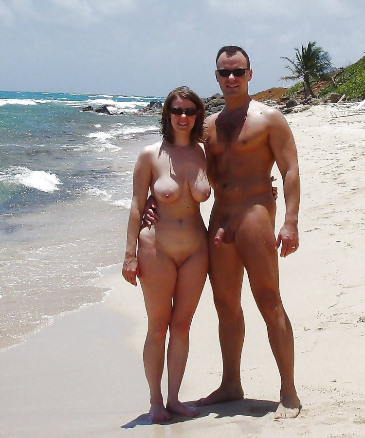 Naked pairs with an erection on the beach