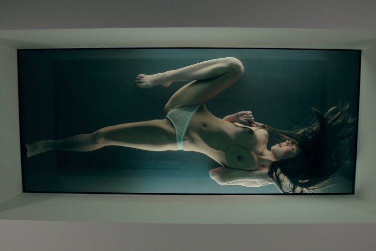 Naked woman on a glass table
