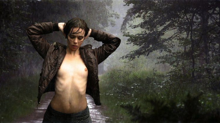Girl in the rain in the forest nude